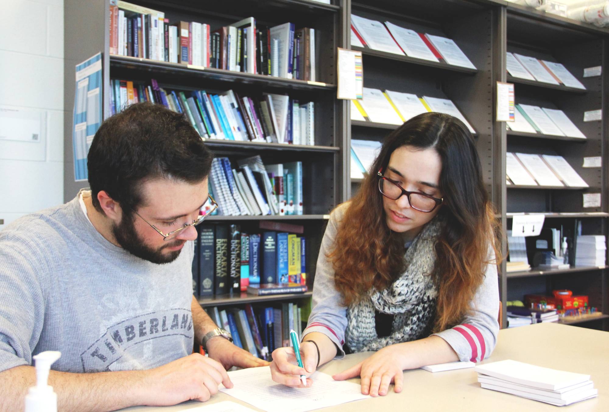 two people working together in the writing center